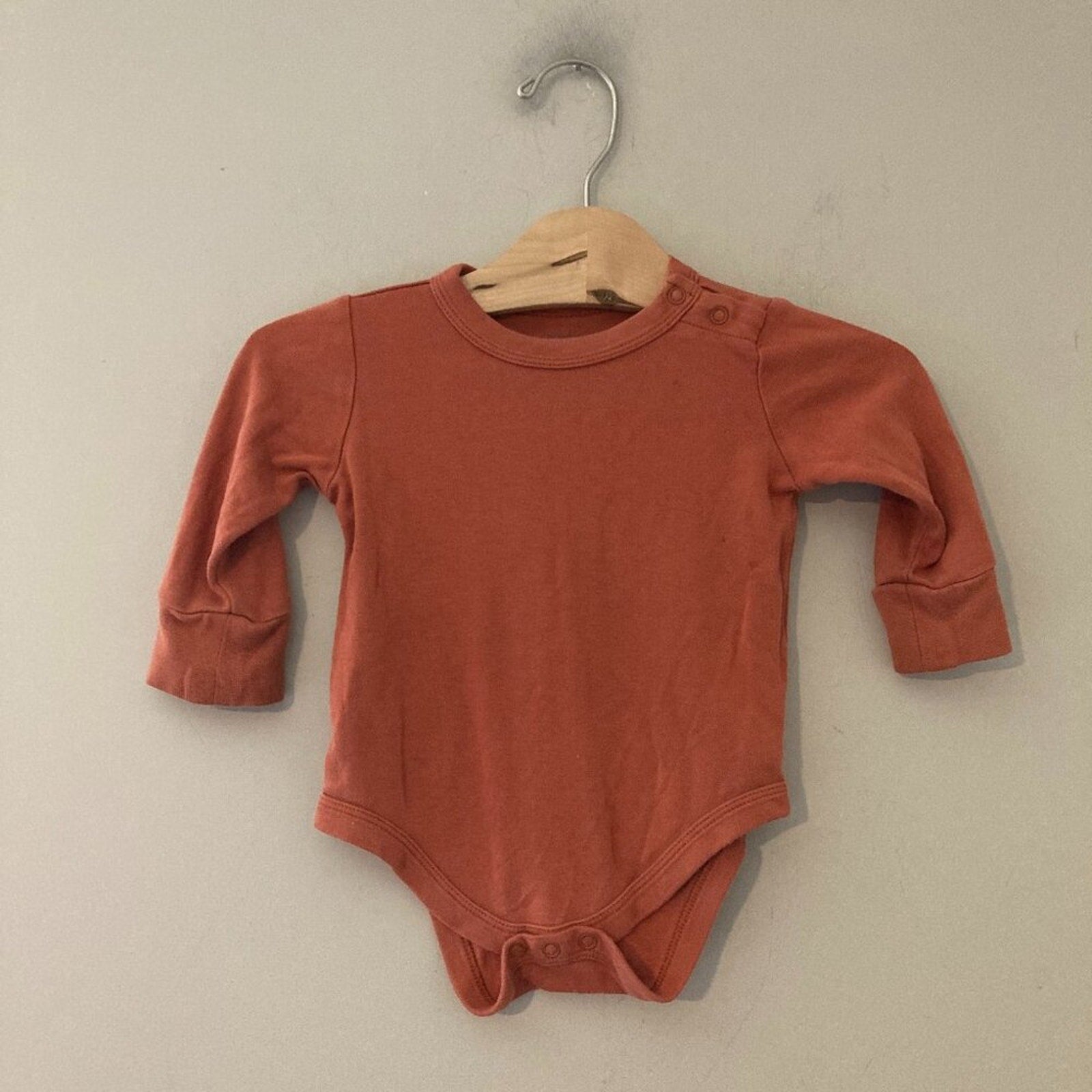 goumi burnt orange bodysuit 6-12M