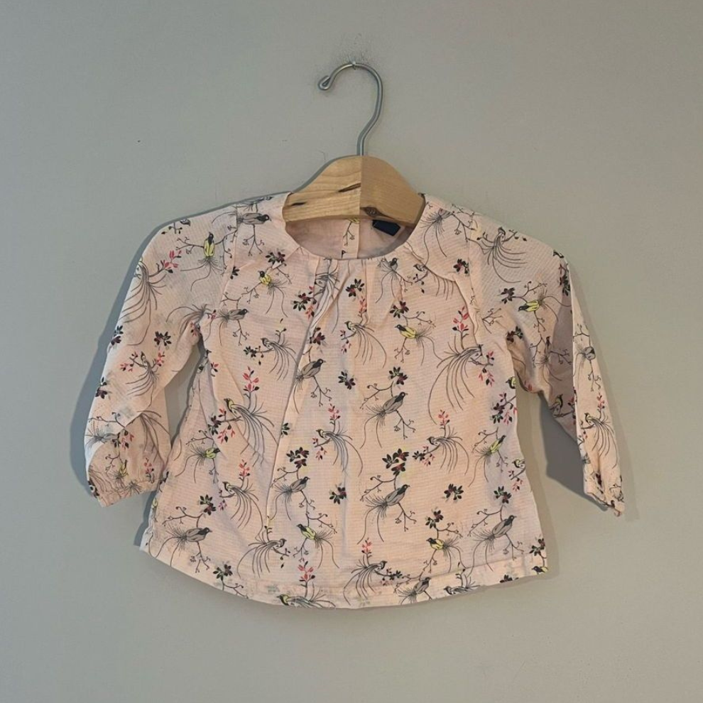 Front view of Baby Gap pink bird print long-sleeve blouse with elastic cuffs for toddler girls 2T