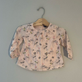 Front view of Baby Gap pink bird print long-sleeve blouse with elastic cuffs for toddler girls 2T