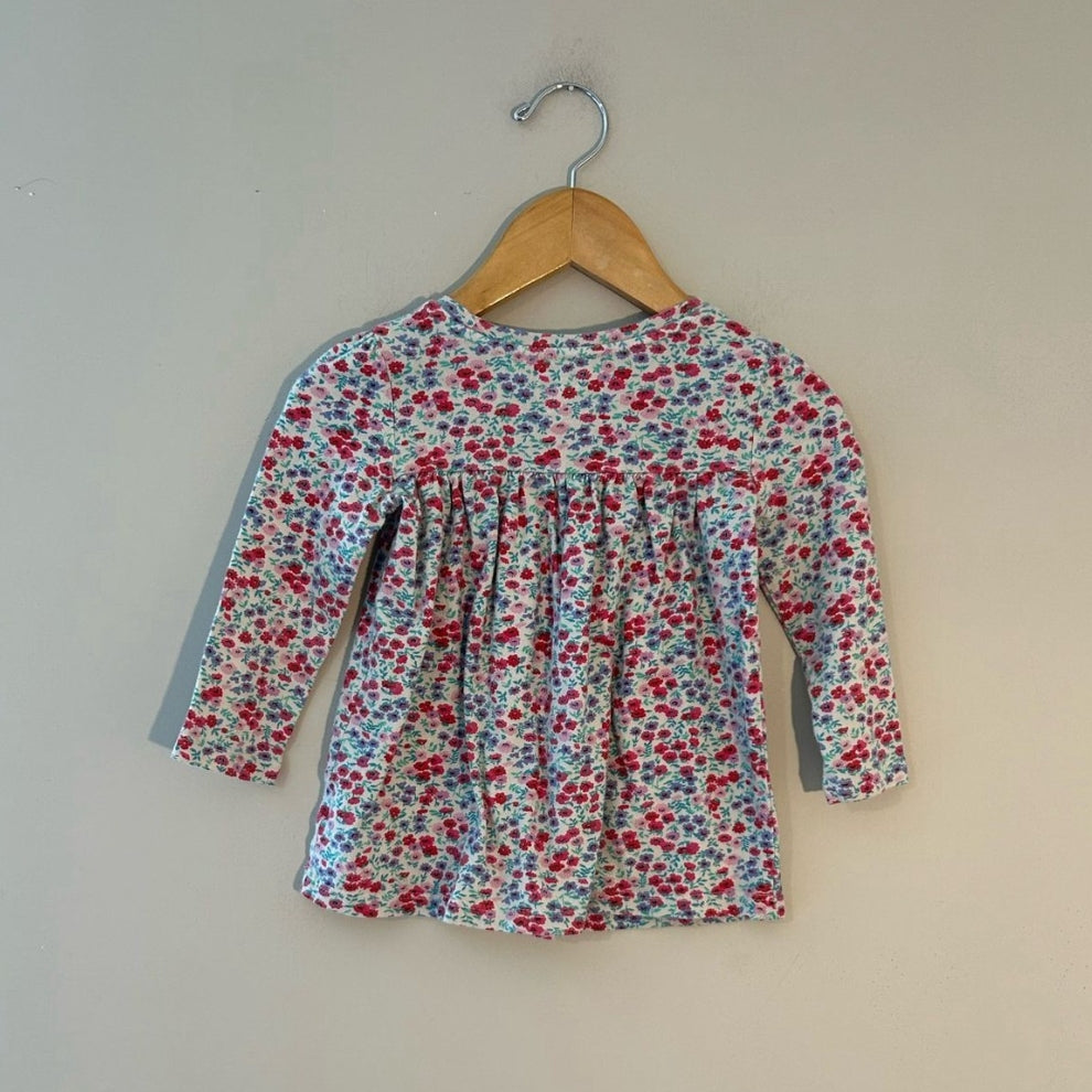 Back view of Baby Gap white floral long-sleeve gathered top for toddler girls size 18 months