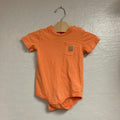 Front view of Carhartt orange cotton bodysuit with chest pocket and logo patch for boys 18M