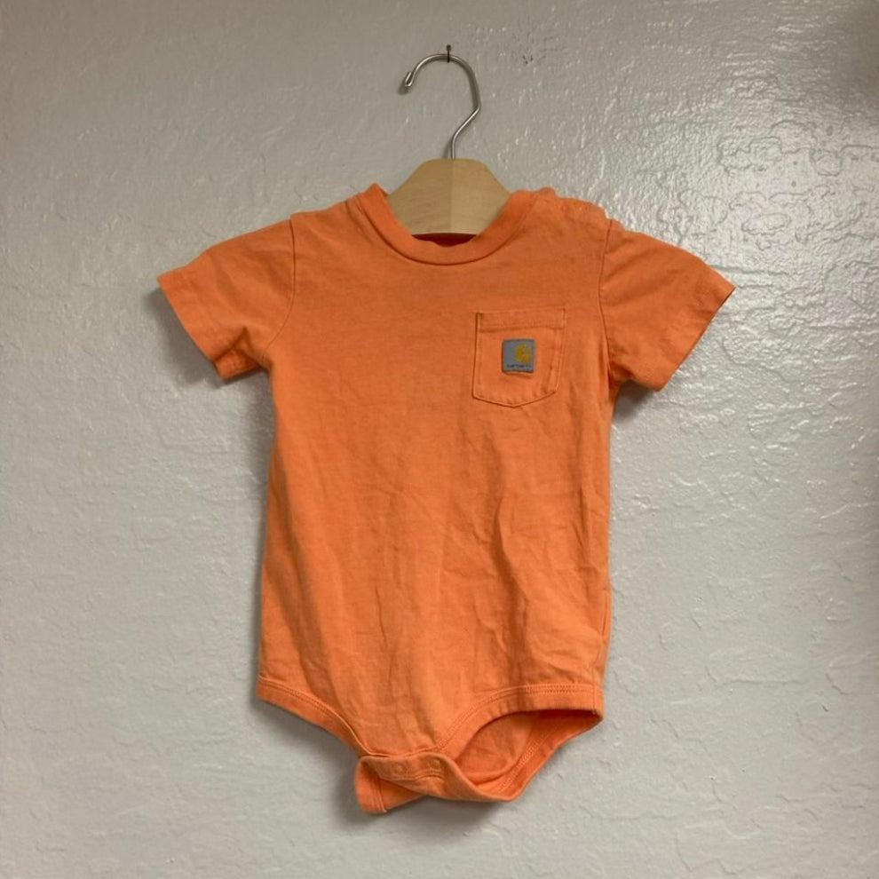 Front view of Carhartt orange cotton bodysuit with chest pocket and logo patch for boys 18M