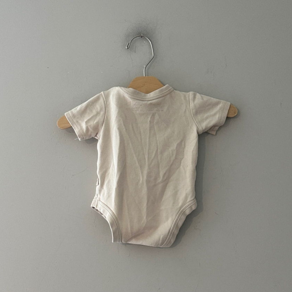 Back view of Goumi x Babylist ivory organic cotton short-sleeve snap bodysuit gender neutral size 6-9M