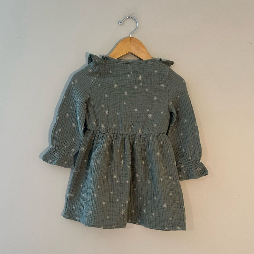 Back view of Grayson Collective dusty teal star embroidered muslin long-sleeve dress with ruffle cuffs for girls 3T