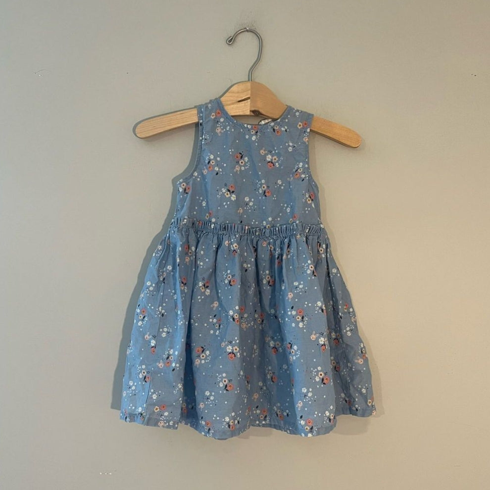 Front view of H&M dusty blue floral sleeveless dress with gathered waist for girls 18-24 months