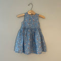 Front view of H&M dusty blue floral sleeveless dress with gathered waist for girls 18-24 months