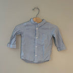 Front view of H&M blue and white striped baby boys long-sleeve button-down shirt with chest pocket size 6-12 months