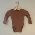 Front view of H&M mocha brown ribbed cotton long-sleeve baby bodysuit with shoulder snaps and crotch closure gender neutral size 6-12 months
