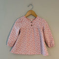 Front view of Kit + Pearl coral pink floral long-sleeve dress with puffed sleeves for toddler girls 24M