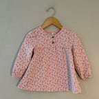 Front view of Kit + Pearl coral pink floral long-sleeve dress with puffed sleeves for toddler girls 24M