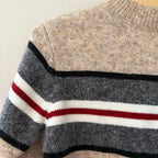 Close-up detail of Mayoral beige wool-blend sweater showing charcoal gray color-block with black white and red stripe pattern for boys 5Y