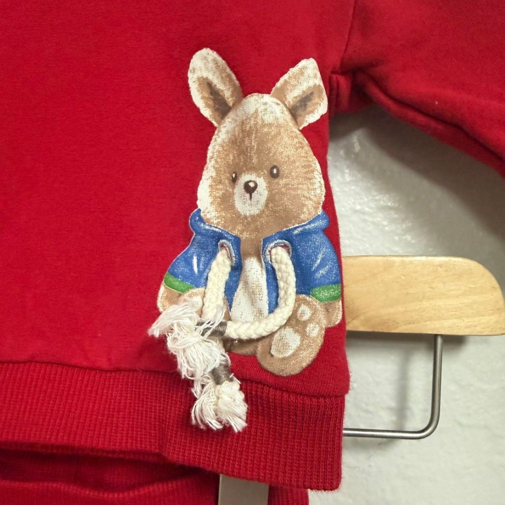 Close-up detail of Mayoral red boys sweatshirt showing 3D teddy bear appliqué in blue jacket with rope tassel detail, size 4Y