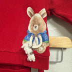 Close-up detail of Mayoral red boys sweatshirt showing 3D teddy bear appliqué in blue jacket with rope tassel detail, size 4Y