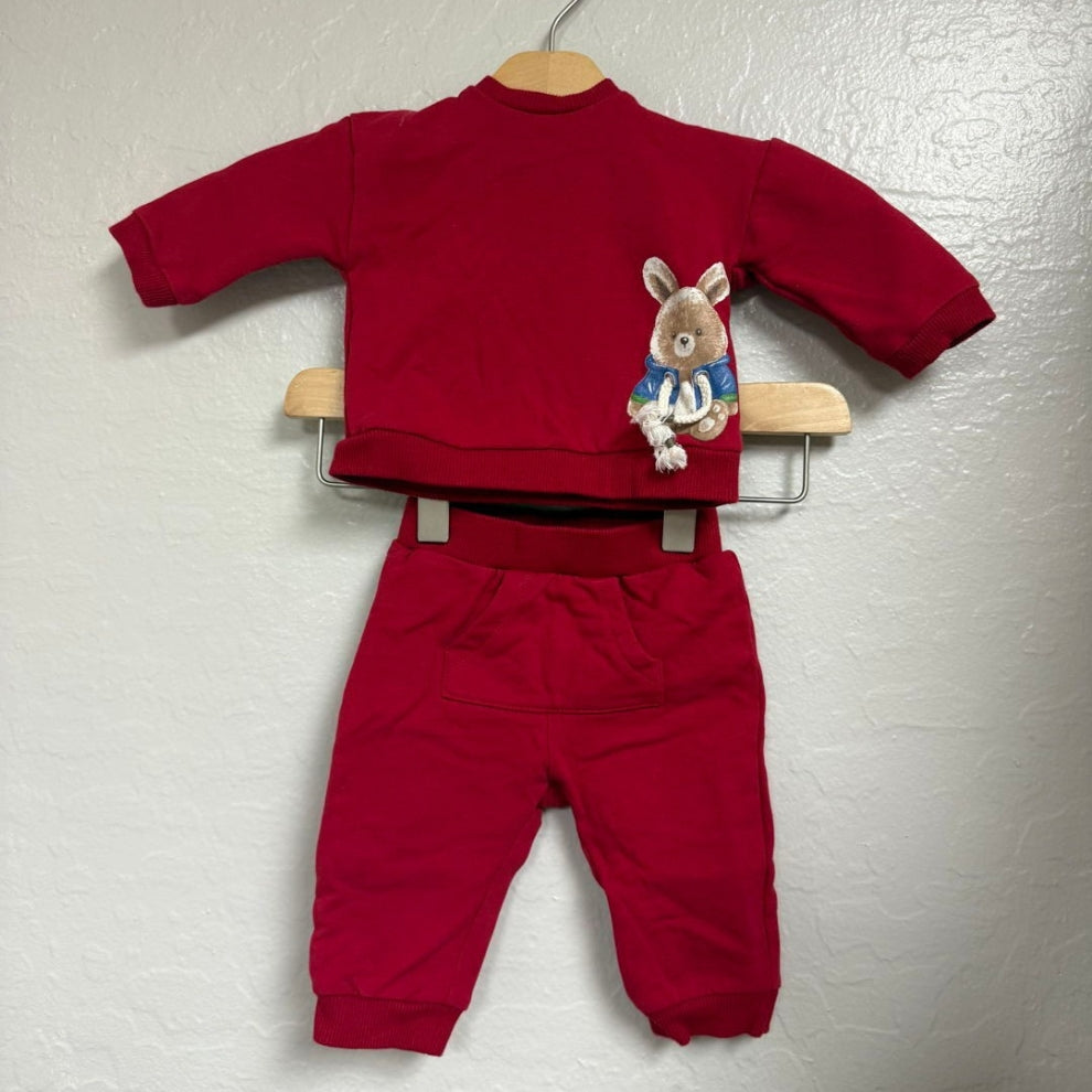 Front view of Mayoral red boys matching set featuring bear appliqué sweatshirt and coordinating jogger pants size 4Y