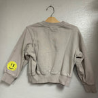 Back view of a Molo light gray crewneck girls’ sweatshirt, size 6Y (EU 116), showing ribbed collar, cuffs, and hem.