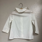 Back view of a Motoreta white long-sleeve girls’ blouse, size 3Y, showing the clean back and collar shape.