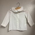 Front view of a Motoreta white girls’ button-down blouse in size 3Y with Peter Pan collar and long sleeves.