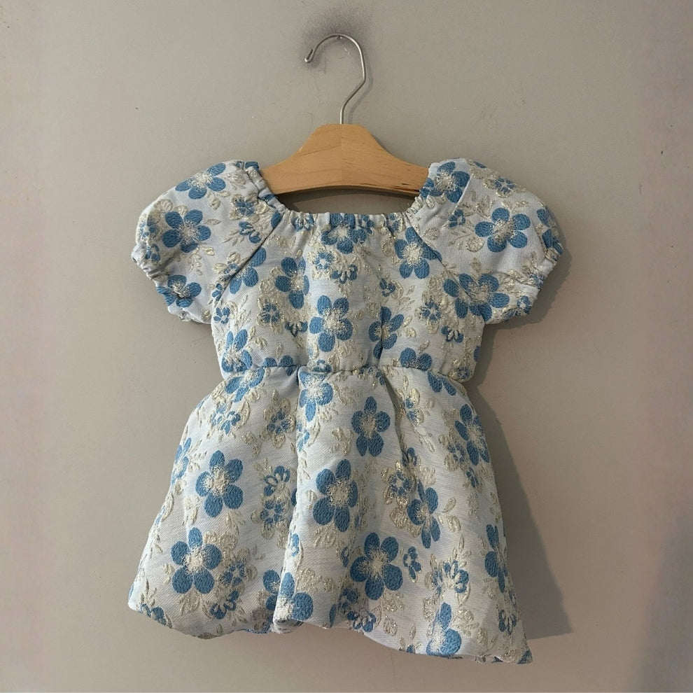 Back view of Peek white and blue floral bubble dress with gathered waist for girls 6-12 months