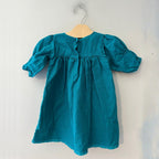 Back view of Tea Collection jade teal green puff sleeve dress with button closure for girls 12-18 months