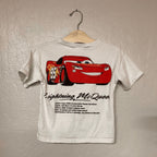 Back view of Zara white Cars tee showing Lightning McQueen full print and vehicle specs text