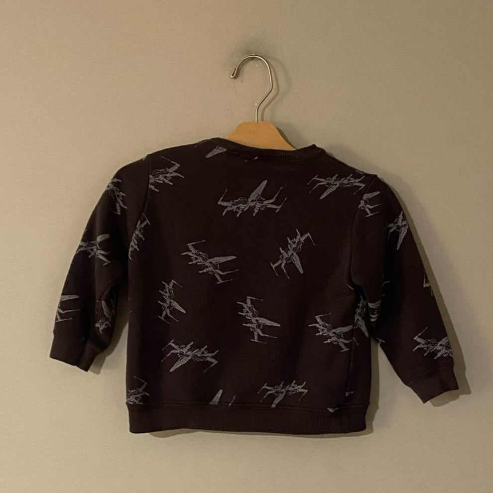 Back view of Zara black sweatshirt featuring all-over X-Wing fighter pattern for toddler boys
