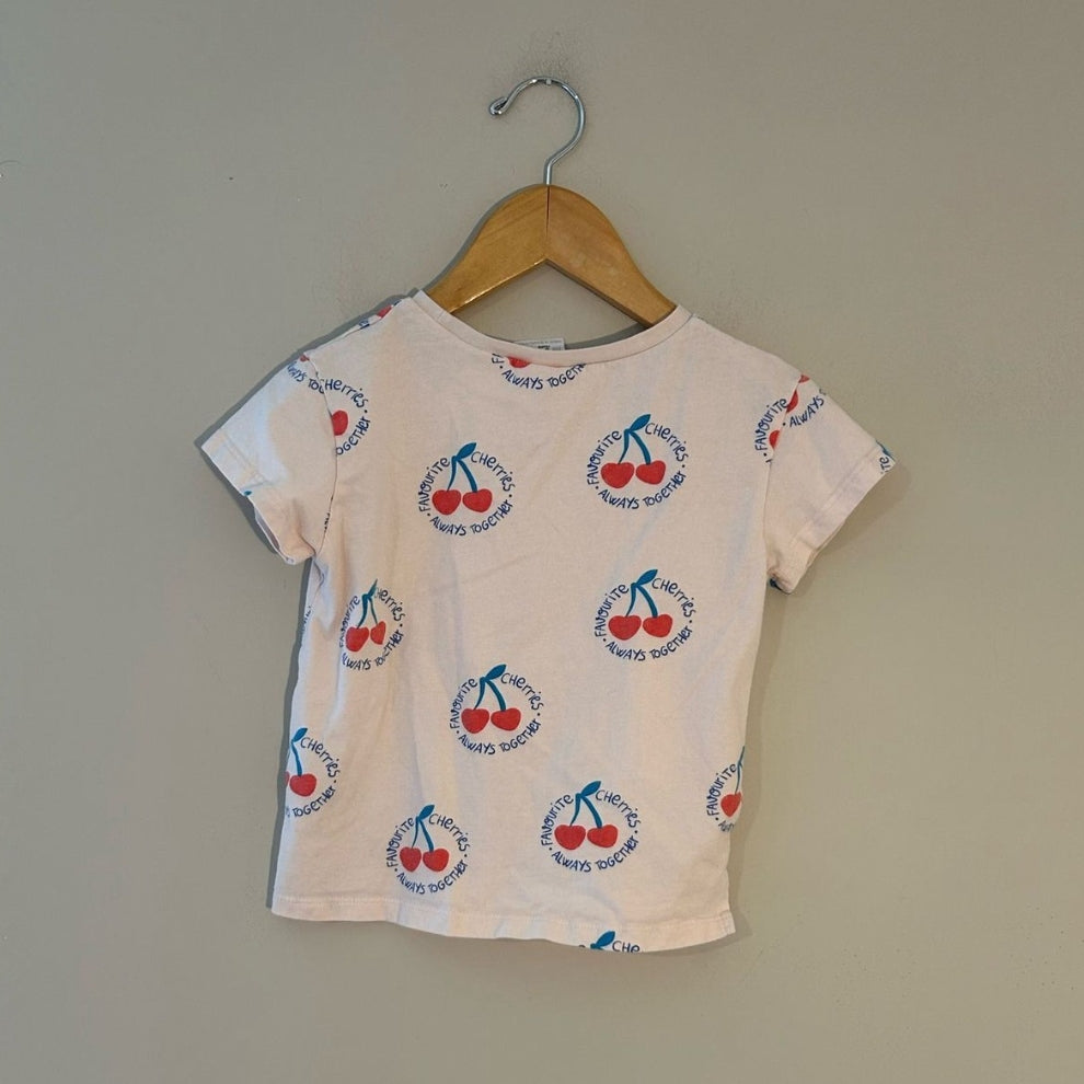 Back view of Zara white short-sleeve all-over cherry print graphic t-shirt for girls size 3 years