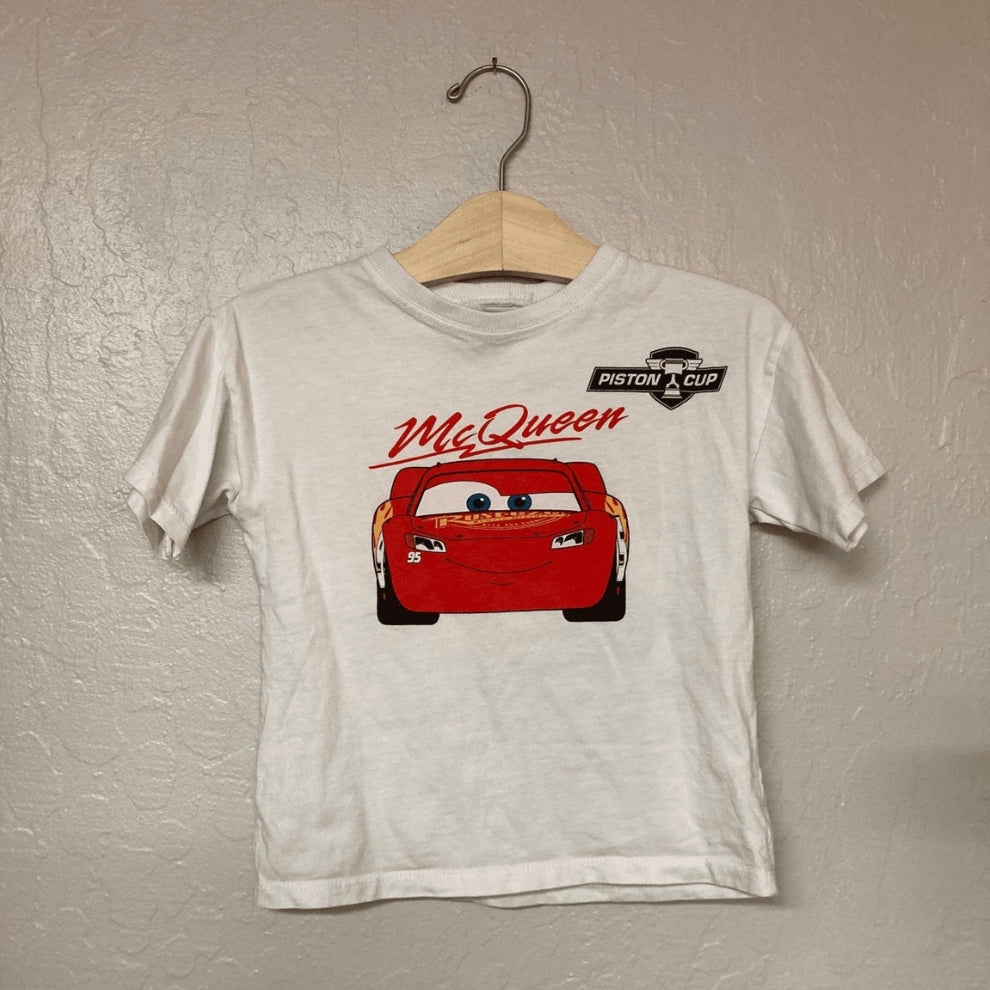 Front view of Zara white short-sleeve t-shirt with Lightning McQueen Piston Cup graphic for toddler boys